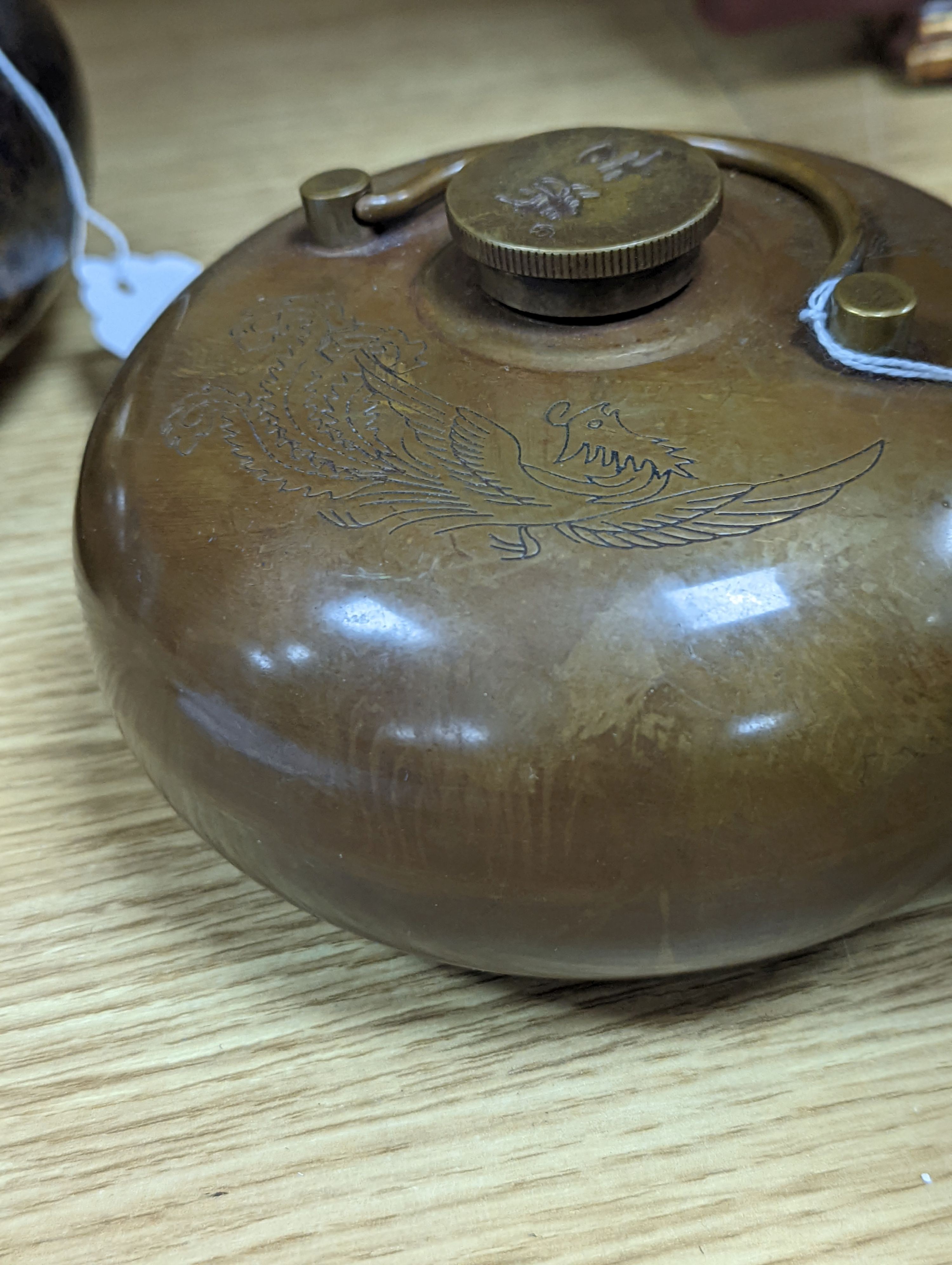 Two Chinese bronze handwarmers and a turquoise glazed jar